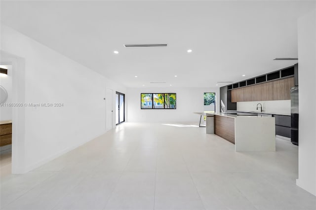 kitchen featuring sink and a kitchen island