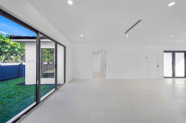 spare room featuring a wealth of natural light