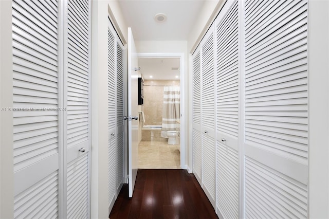 corridor featuring dark hardwood / wood-style flooring