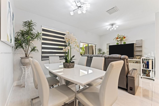 dining space with a chandelier