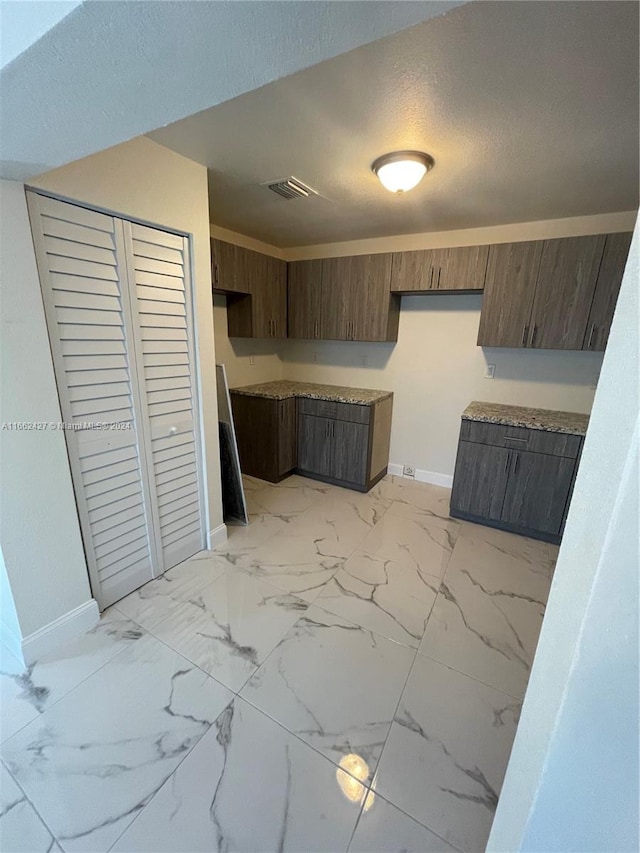 bedroom featuring a closet and a textured ceiling