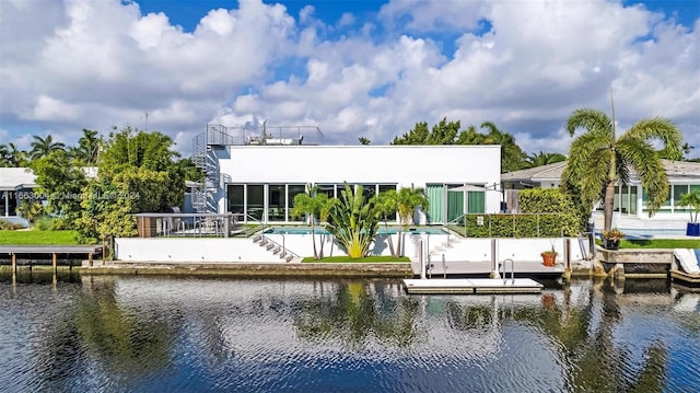 dock area featuring a patio and a water view