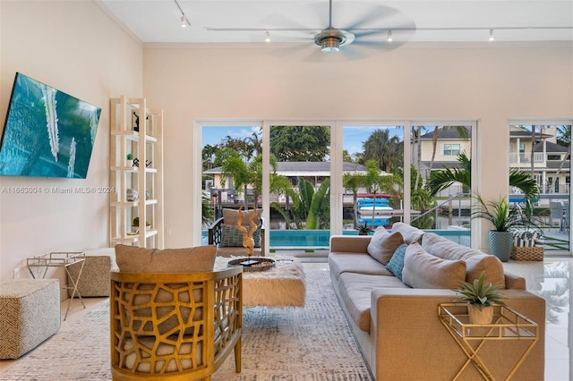 2112 NE 17th Ave, Wilton Manors, FL 33305 - living area featuring rail lighting and ceiling fan