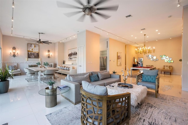 2112 NE 17th Ave, Wilton Manors, FL 33305 - living room featuring track lighting, tile patterned flooring, ceiling fan with notable chandelier, and visible vents