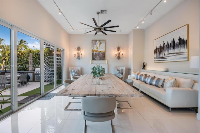 2112 NE 17th Ave, Wilton Manors, FL 33305 - tiled dining room with a ceiling fan, rail lighting, and visible vents