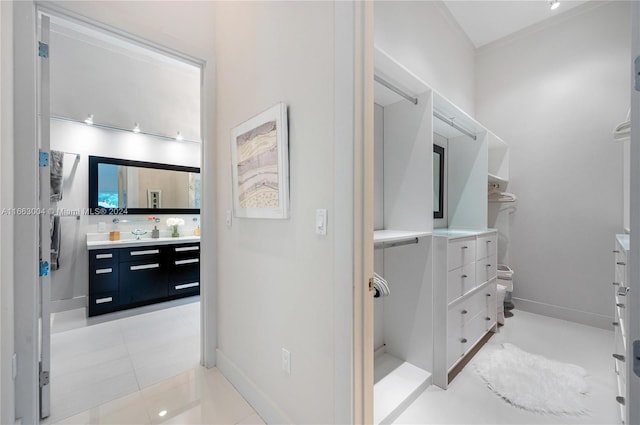 2112 NE 17th Ave, Wilton Manors, FL 33305 - interior space featuring vanity, baseboards, and tile patterned flooring