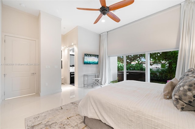 2112 NE 17th Ave, Wilton Manors, FL 33305 - tiled bedroom with a ceiling fan and ensuite bath