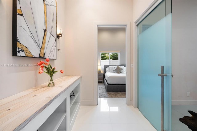 2112 NE 17th Ave, Wilton Manors, FL 33305 - corridor with baseboards and light tile patterned floors