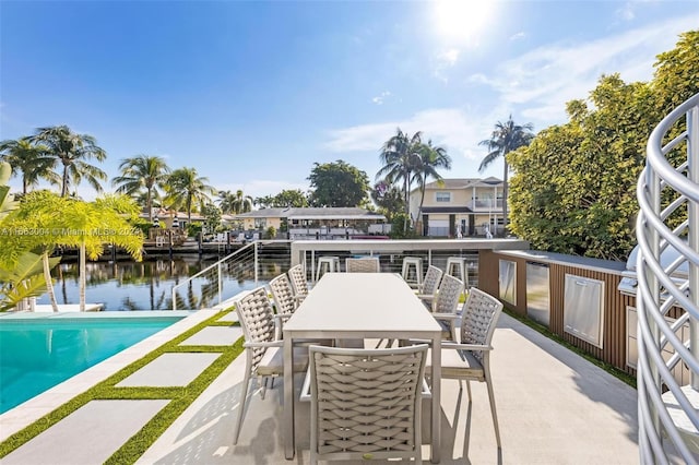2112 NE 17th Ave, Wilton Manors, FL 33305 - balcony featuring a water view, a patio area, and outdoor dining space
