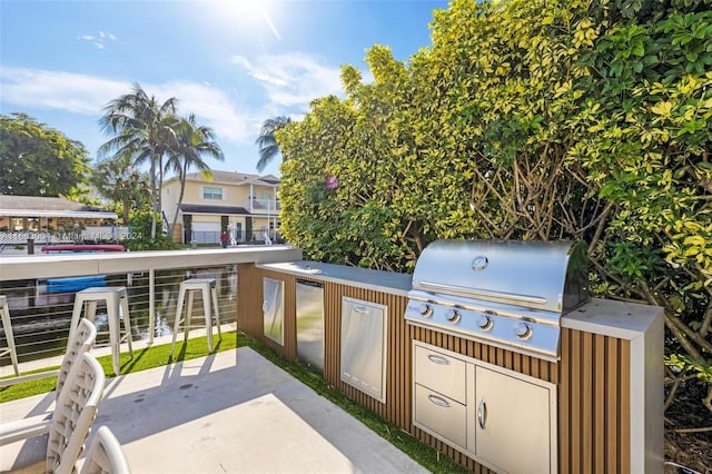 2112 NE 17th Ave, Wilton Manors, FL 33305 - view of patio / terrace featuring grilling area and exterior kitchen