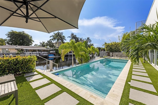 2112 NE 17th Ave, Wilton Manors, FL 33305 - pool featuring a water view and a patio area
