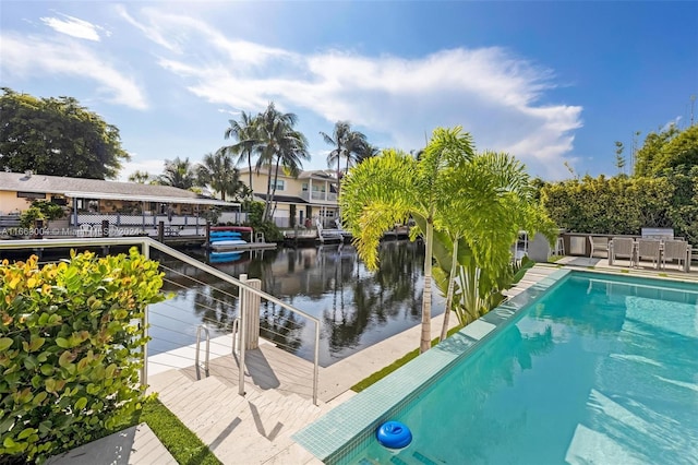 2112 NE 17th Ave, Wilton Manors, FL 33305 - view of swimming pool featuring a water view