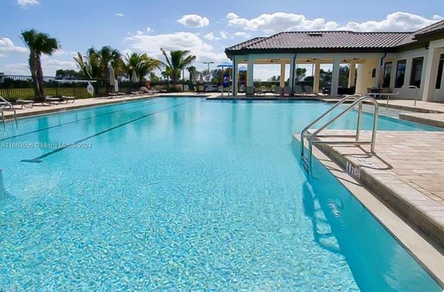 view of pool featuring a patio