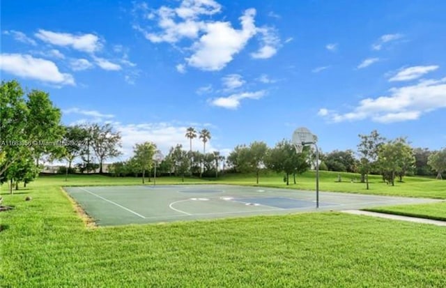 view of sport court featuring a yard