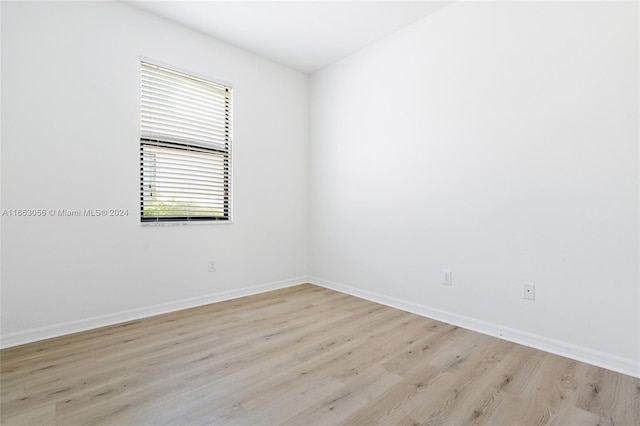 empty room with light wood-type flooring