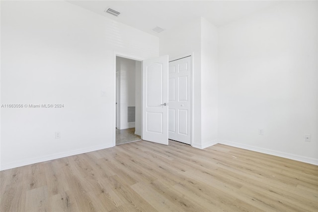 spare room with light wood-type flooring