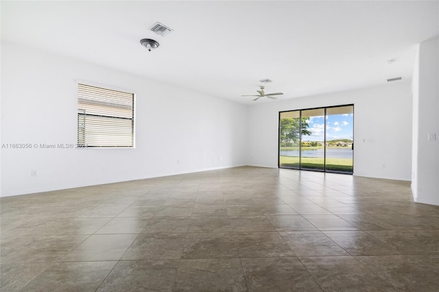 unfurnished room with ceiling fan