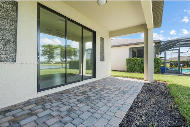 view of patio / terrace with a lanai