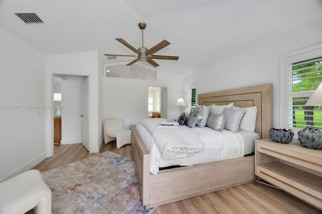 bedroom featuring lofted ceiling, ceiling fan, and light hardwood / wood-style floors