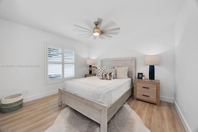 bedroom featuring light wood-type flooring and ceiling fan