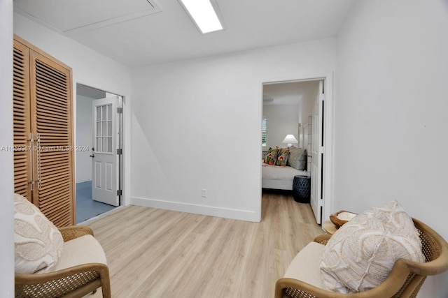 living area with light hardwood / wood-style floors