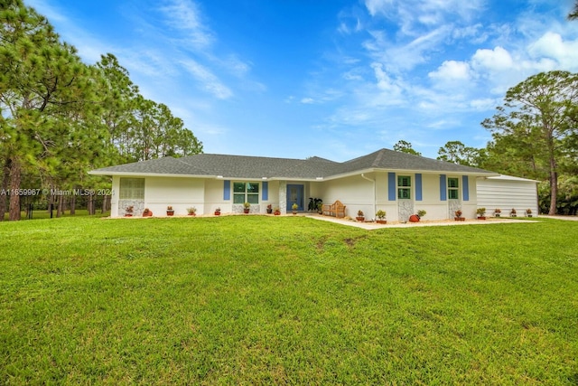 ranch-style house with a front lawn