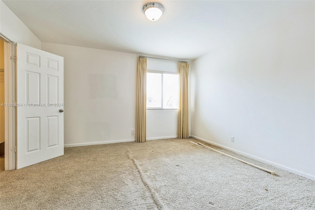 empty room with carpet flooring