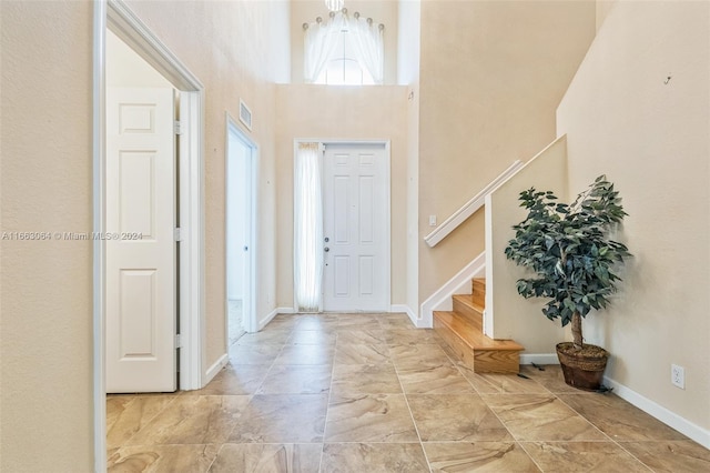 entryway with a high ceiling