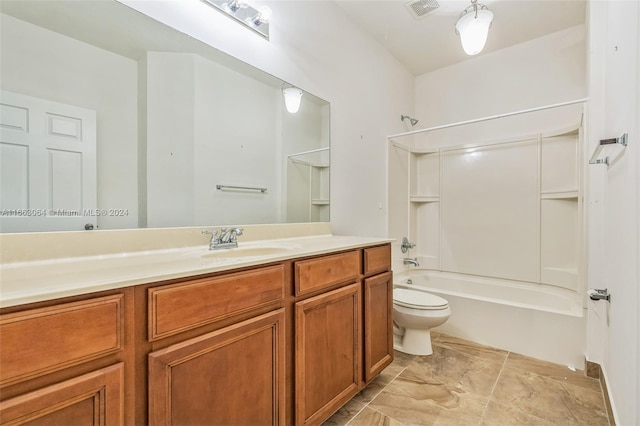 full bathroom featuring shower / washtub combination, vanity, and toilet