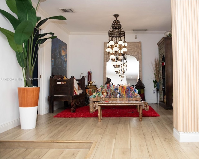 dining space with ornamental molding and hardwood / wood-style floors