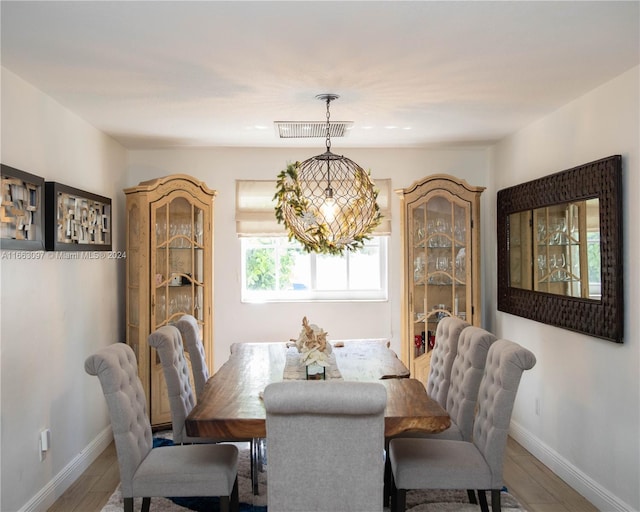 dining room with hardwood / wood-style flooring