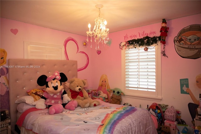 bedroom featuring a chandelier