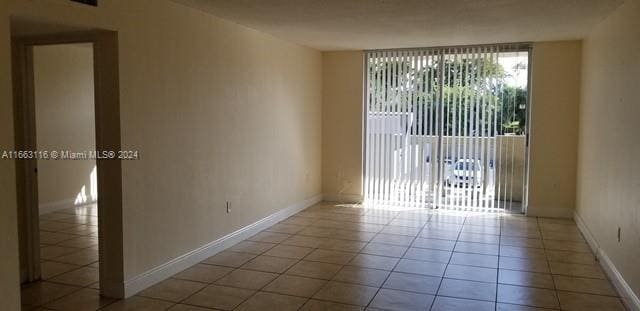 view of tiled spare room