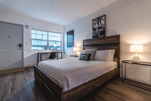 bedroom featuring dark hardwood / wood-style floors