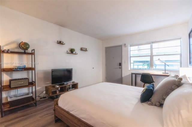 bedroom featuring dark hardwood / wood-style floors