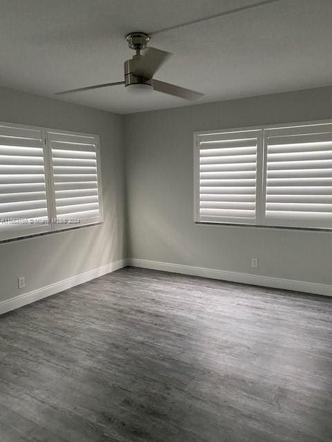 unfurnished room with ceiling fan and hardwood / wood-style flooring