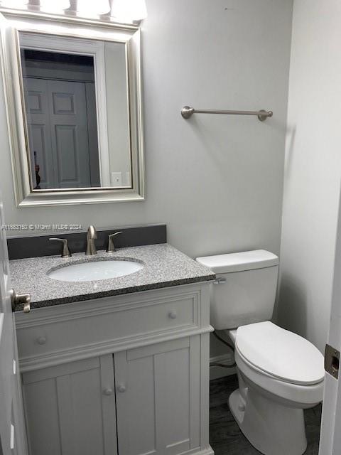 bathroom with vanity and toilet