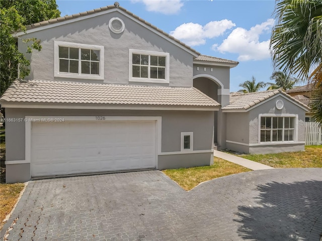 view of front of property with a garage