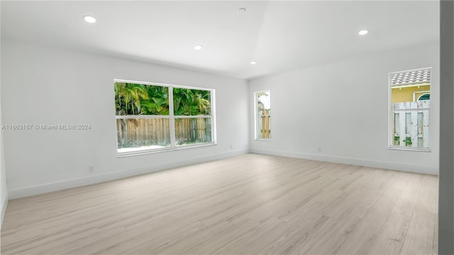 spare room with light hardwood / wood-style floors