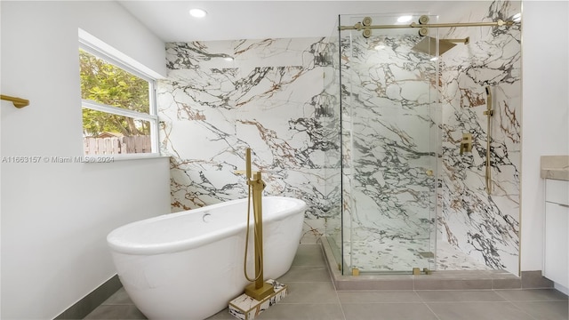 bathroom with vanity, tile patterned flooring, and separate shower and tub