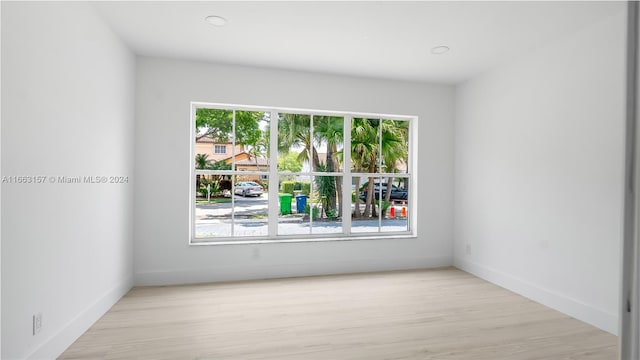 spare room featuring light wood-type flooring