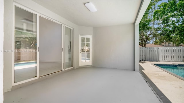 view of patio / terrace featuring a fenced in pool