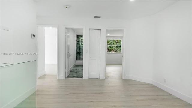 unfurnished room featuring light wood-type flooring