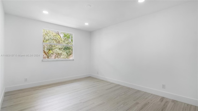 unfurnished room featuring light wood-type flooring