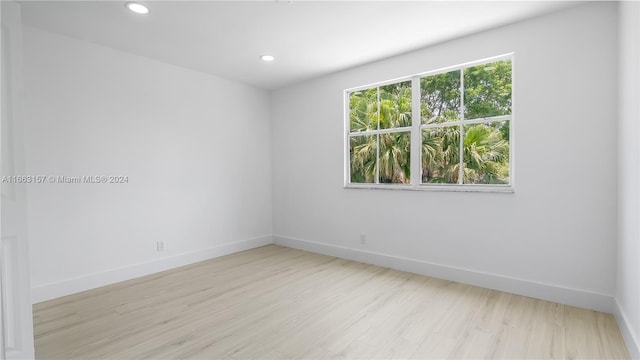 spare room featuring light hardwood / wood-style flooring