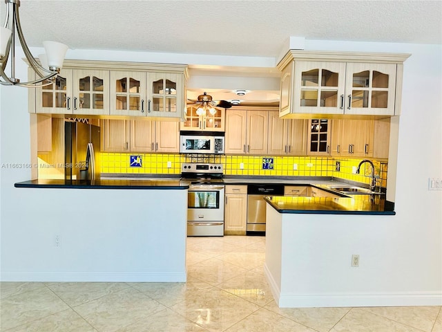 kitchen with dishwasher, sink, kitchen peninsula, electric range oven, and black refrigerator