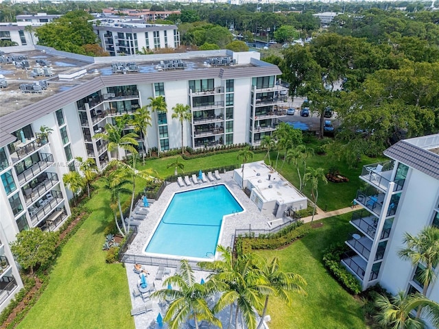 view of pool with a yard