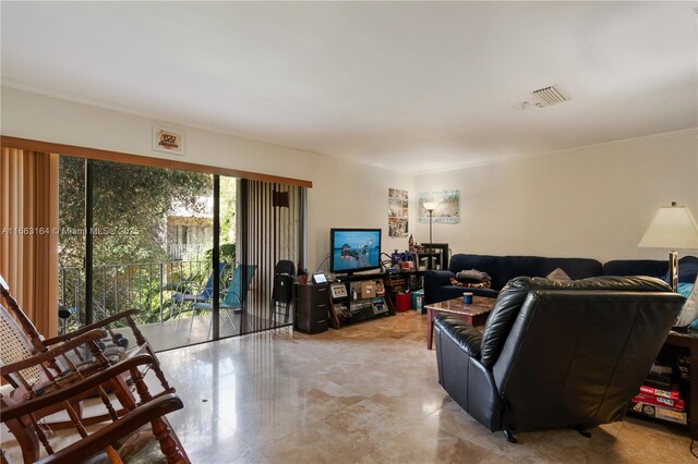 living room featuring ornamental molding