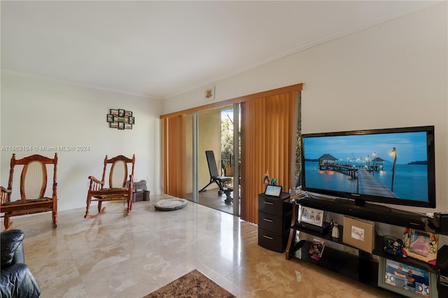 living area with crown molding