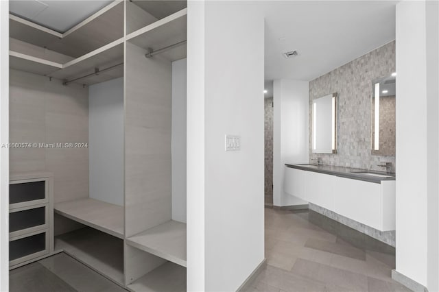 68 SE 6th St Unit 3102, Miami, FL 33131 - walk in closet with a sink